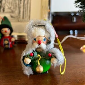 Vintage Steinbach Santa Ornament with blue hooded cloak and garland